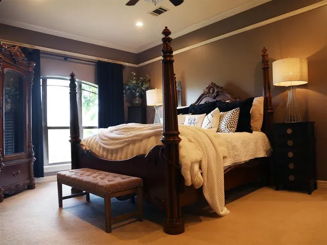 a bed room with a bed and a window