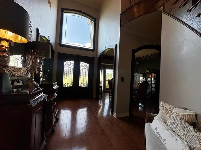 a view of a entryway door of the house and living room