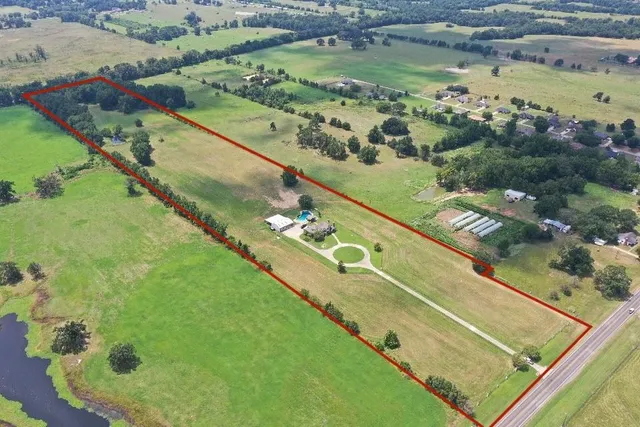 a view of a pool with a yard