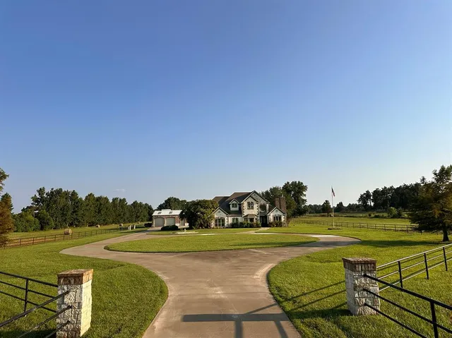 a view of a golf course with a lake