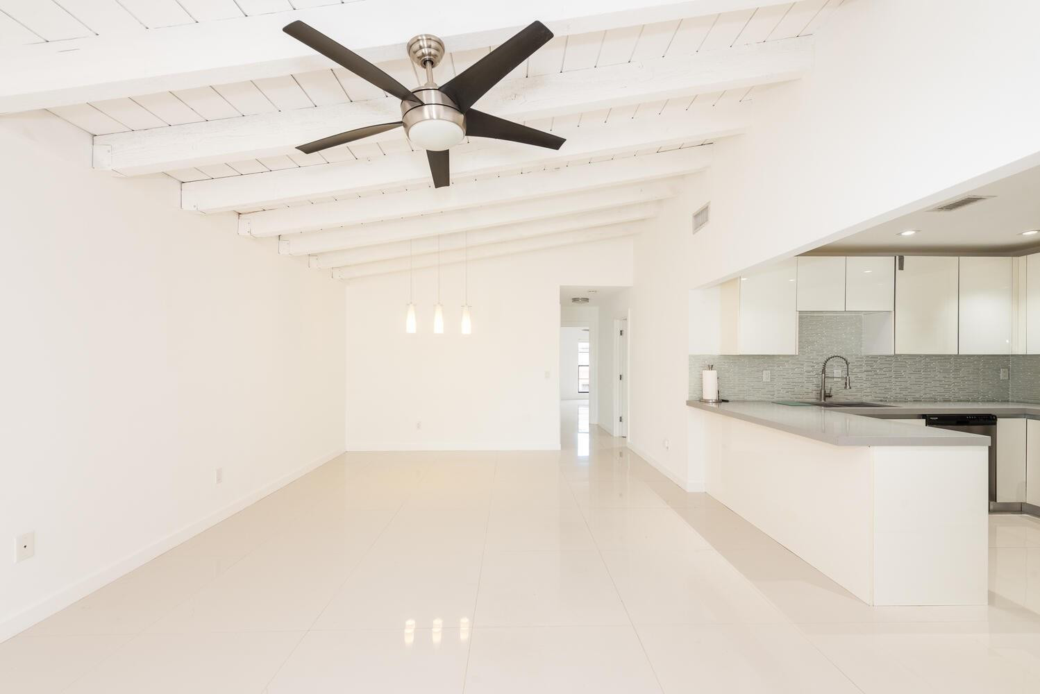 a view of a kitchen with a sink and a dishwasher