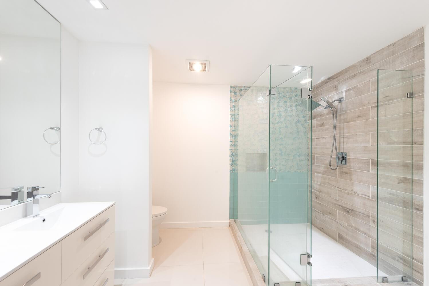 6604 Southwest 114th Place, Unit C72 Miami, FL 33173 - Photo 18 of 28 a bathroom with a shower sink and mirror