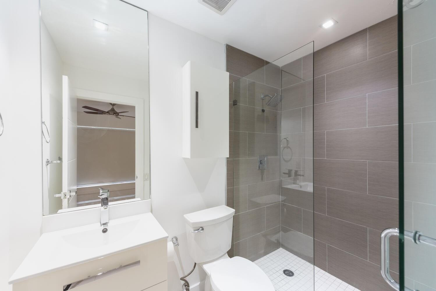 6604 Southwest 114th Place, Unit C72 Miami, FL 33173 - Photo 26 of 28 a bathroom with a sink toilet and shower