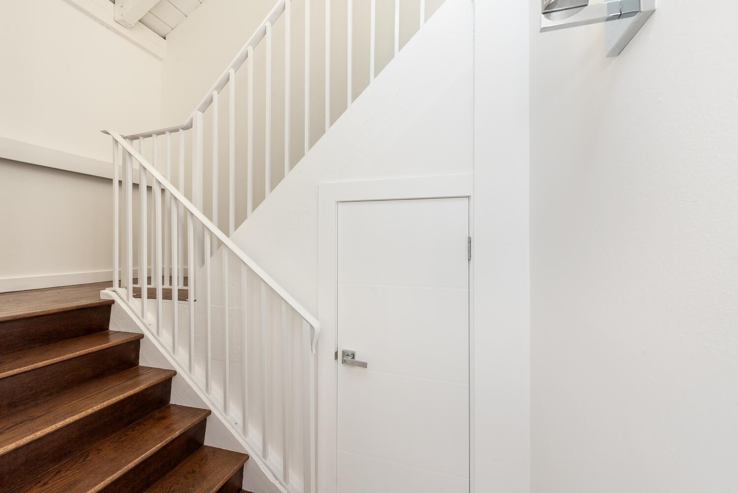 6604 Southwest 114th Place, Unit C72 Miami, FL 33173 - Photo 4 of 28 a view of staircase with wooden floor and white walls