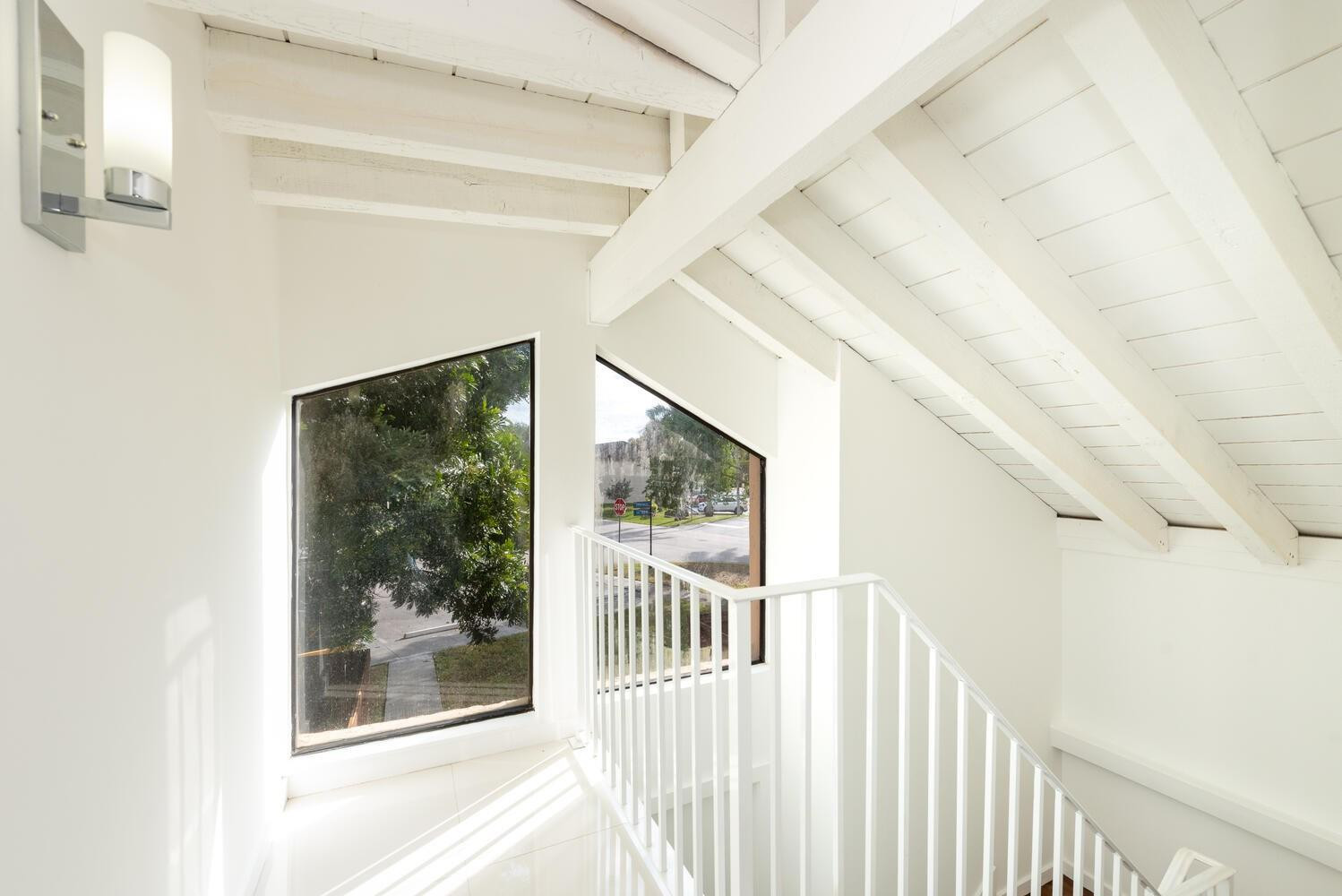 6604 Southwest 114th Place, Unit C72 Miami, FL 33173 - Photo 6 of 28 a view of a hallway with wooden floor and door