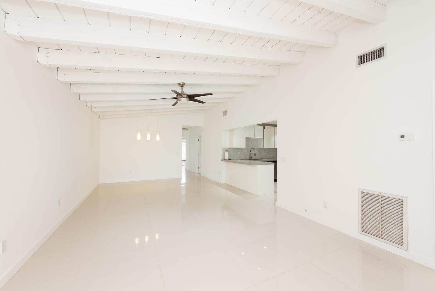 6604 Southwest 114th Place, Unit C72 Miami, FL 33173 - Photo 8 of 28 an empty room with cabinet and mirrors