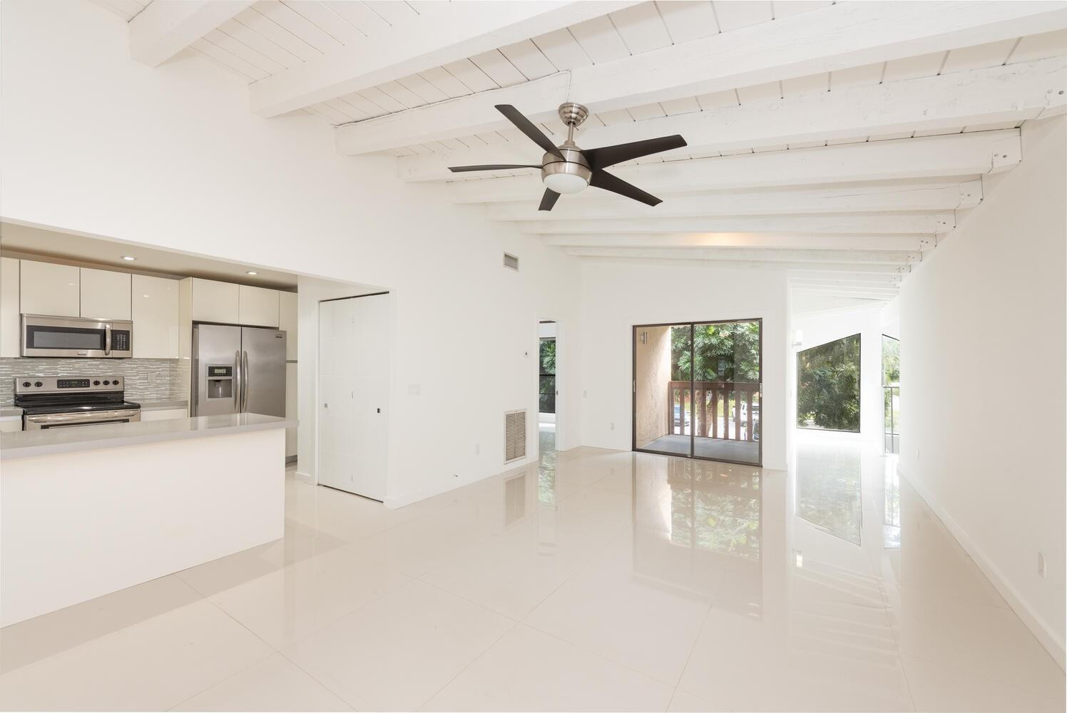 6604 Southwest 114th Place, Unit C72 Miami, FL 33173 - Photo 9 of 28 a view of a living room a refrigerator and a stove