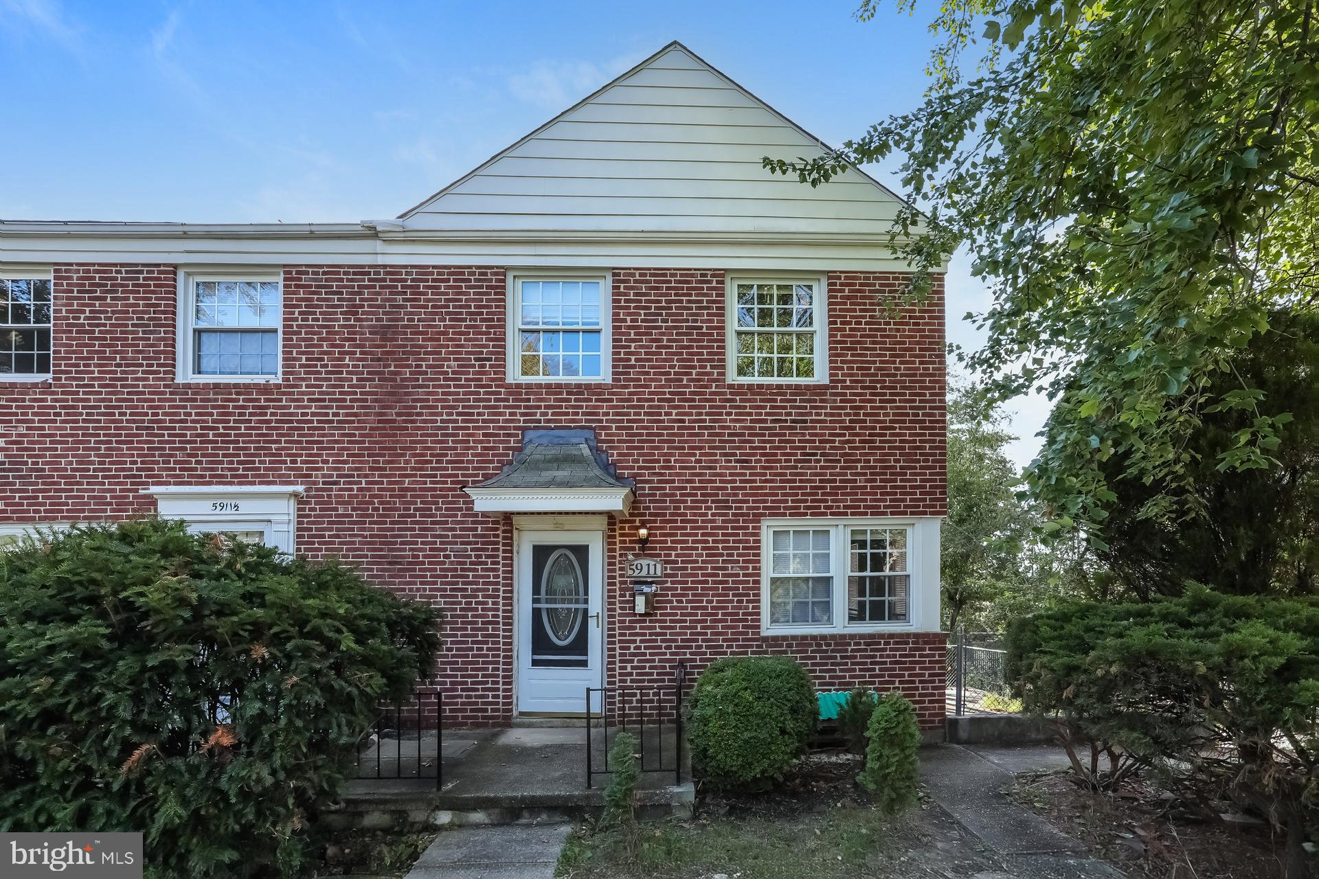 5911 Ayleshire Road Baltimore, MD 21239 - Photo 1 of 10 a front view of a house with plants and trees