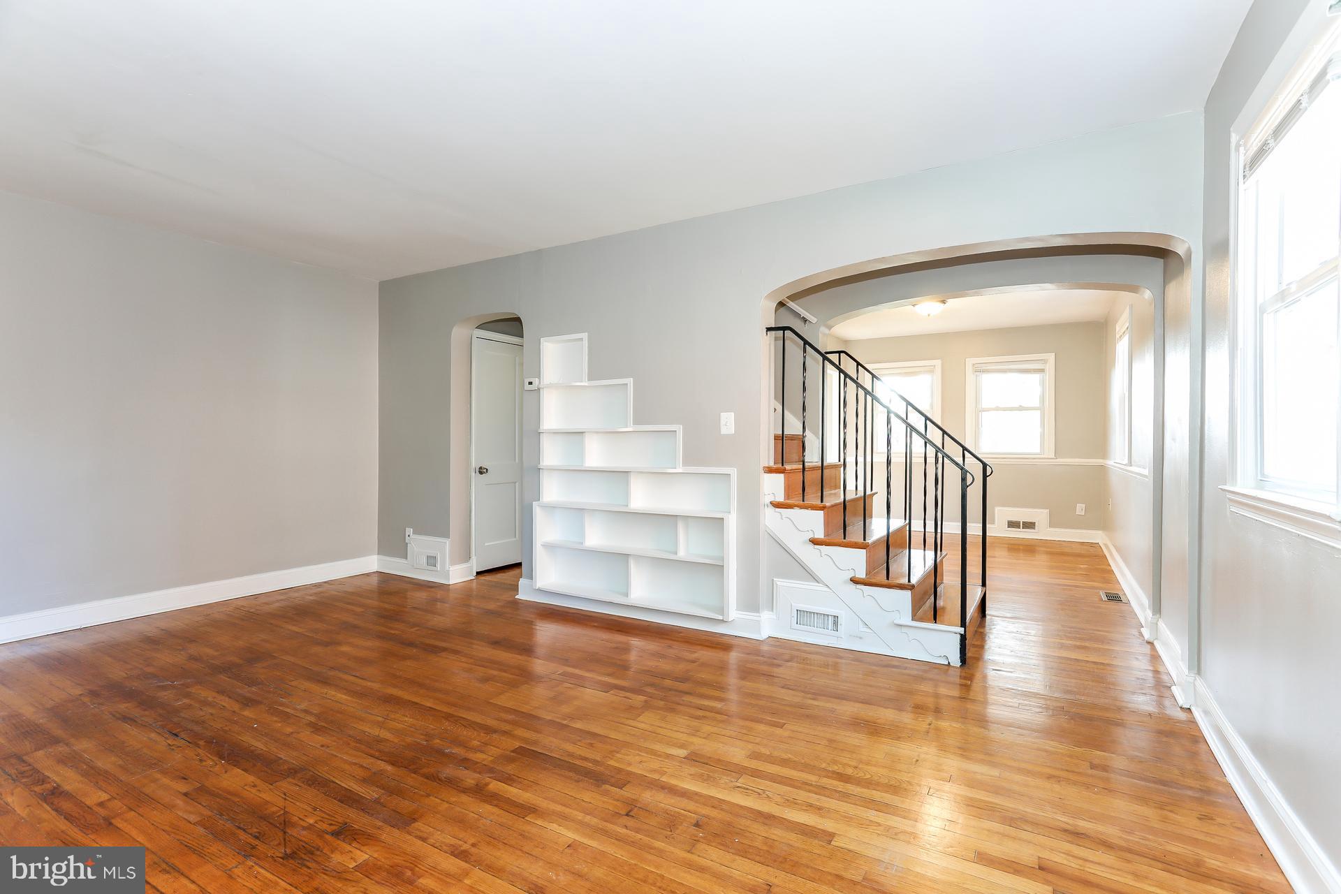 5911 Ayleshire Road Baltimore, MD 21239 - Photo 2 of 10 a view of entryway and hall with wooden floor
