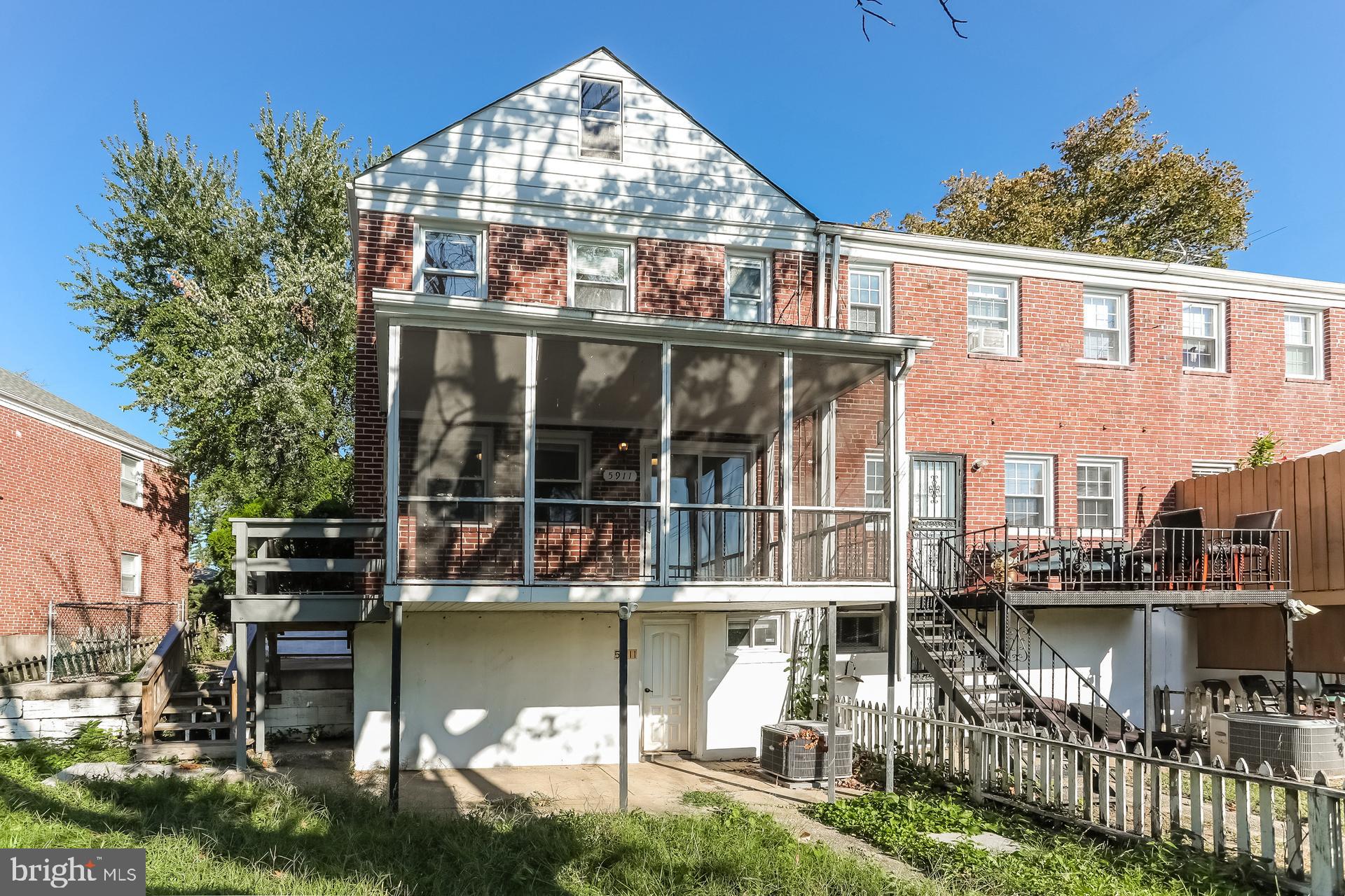 5911 Ayleshire Road Baltimore, MD 21239 - Photo 10 of 10 a view of a lake with a house