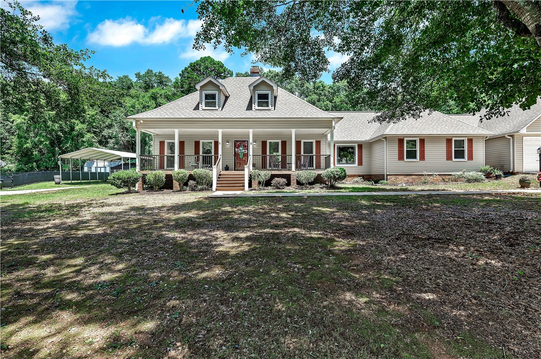 910 Chantilly Lane Anderson, SC 29625 - Photo 1 of 38 A classic ranch home, graced by a welcoming covered porch, sits surrounded by mature trees and a manicured lawn.