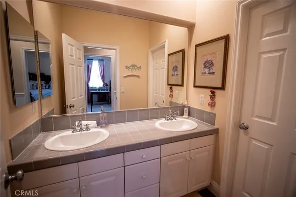 a view of staircase and kitchen with sink