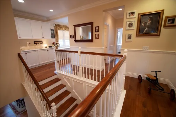 a bathroom with double vanity sinks and a large mirror