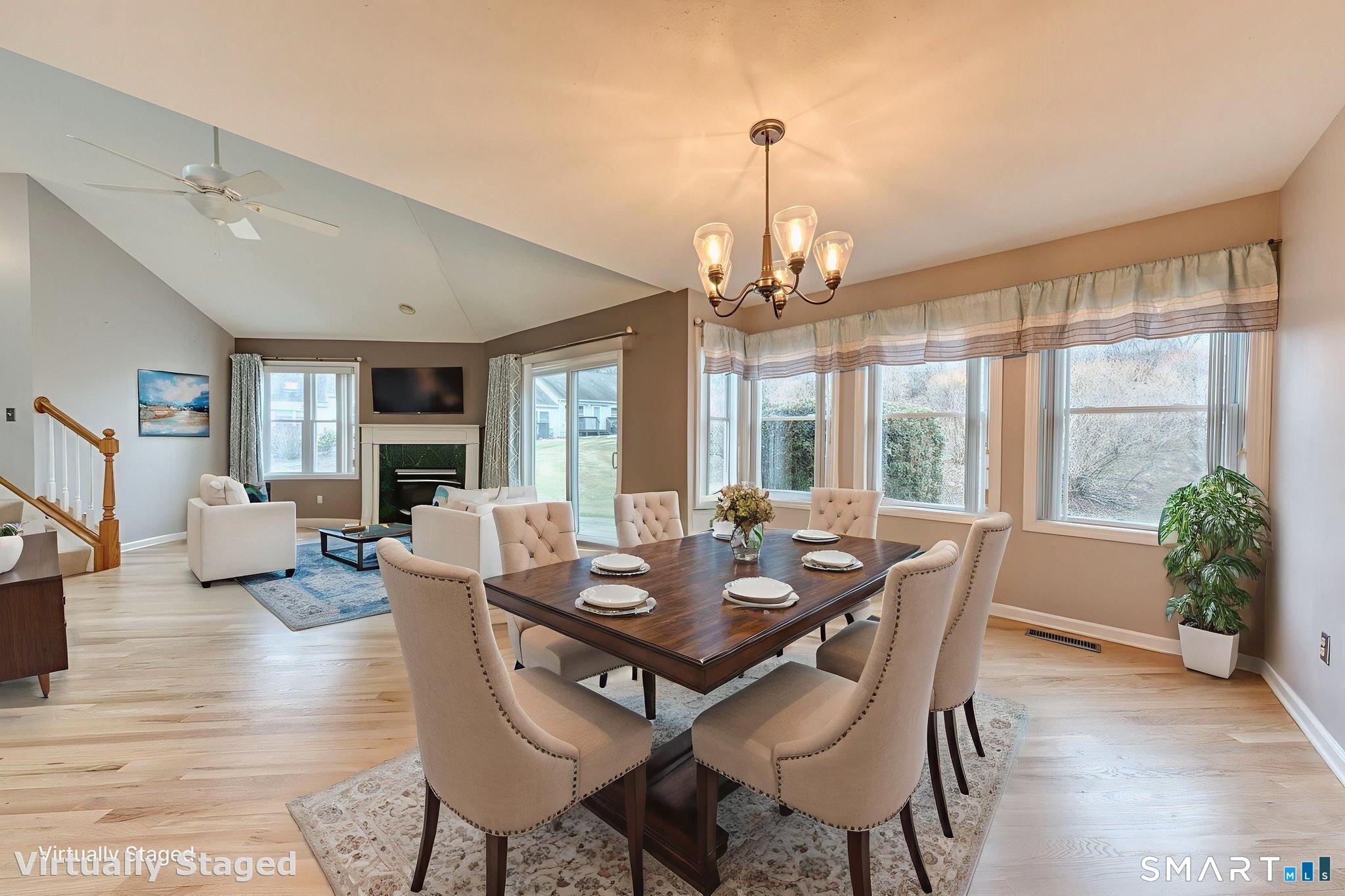 811 Village Road, Unit 811 Southington, CT 06489 - Photo 11 of 40 a view of a dining room with furniture window and wooden floor