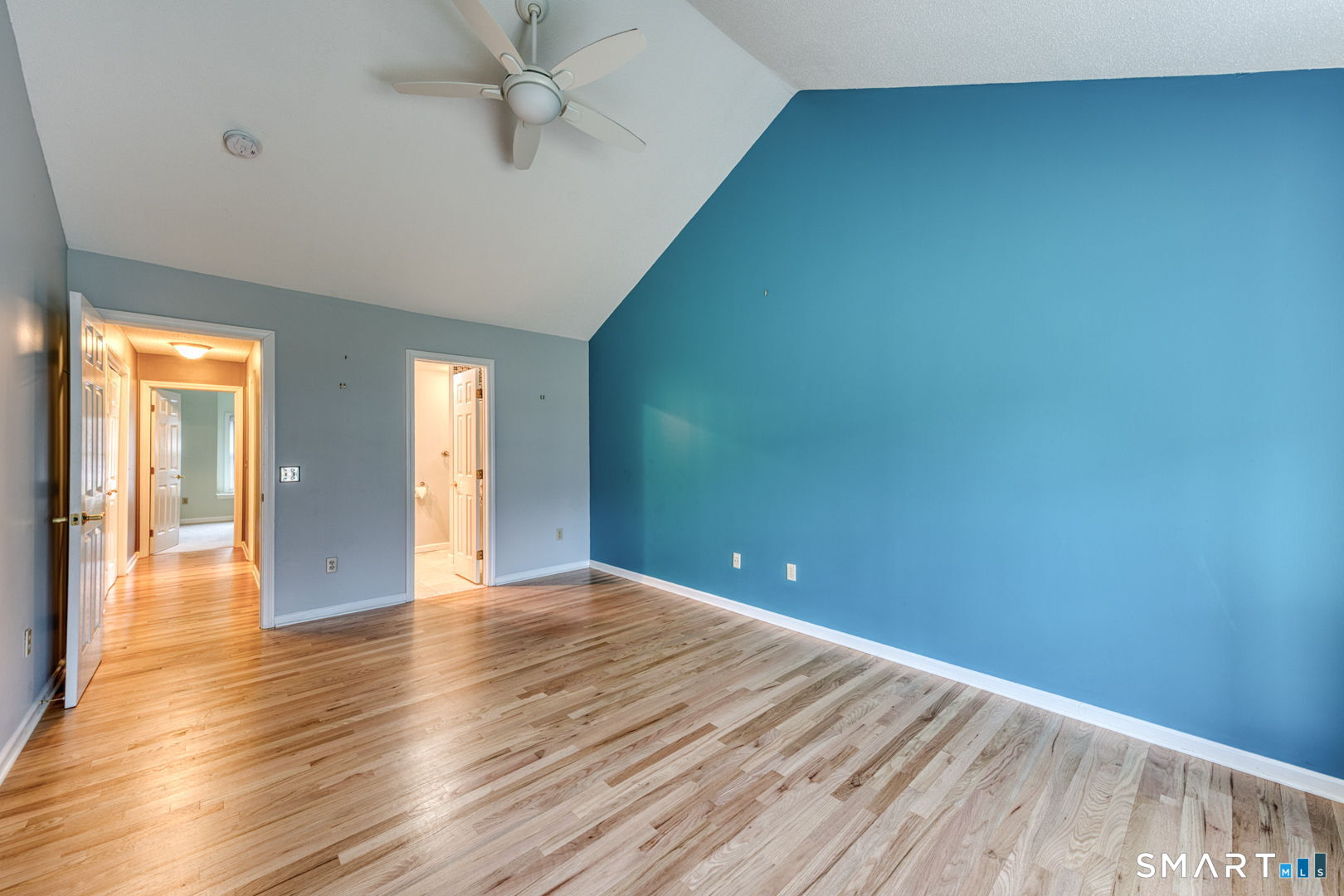 811 Village Road, Unit 811 Southington, CT 06489 - Photo 12 of 40 a view of an empty room with window and wooden floor