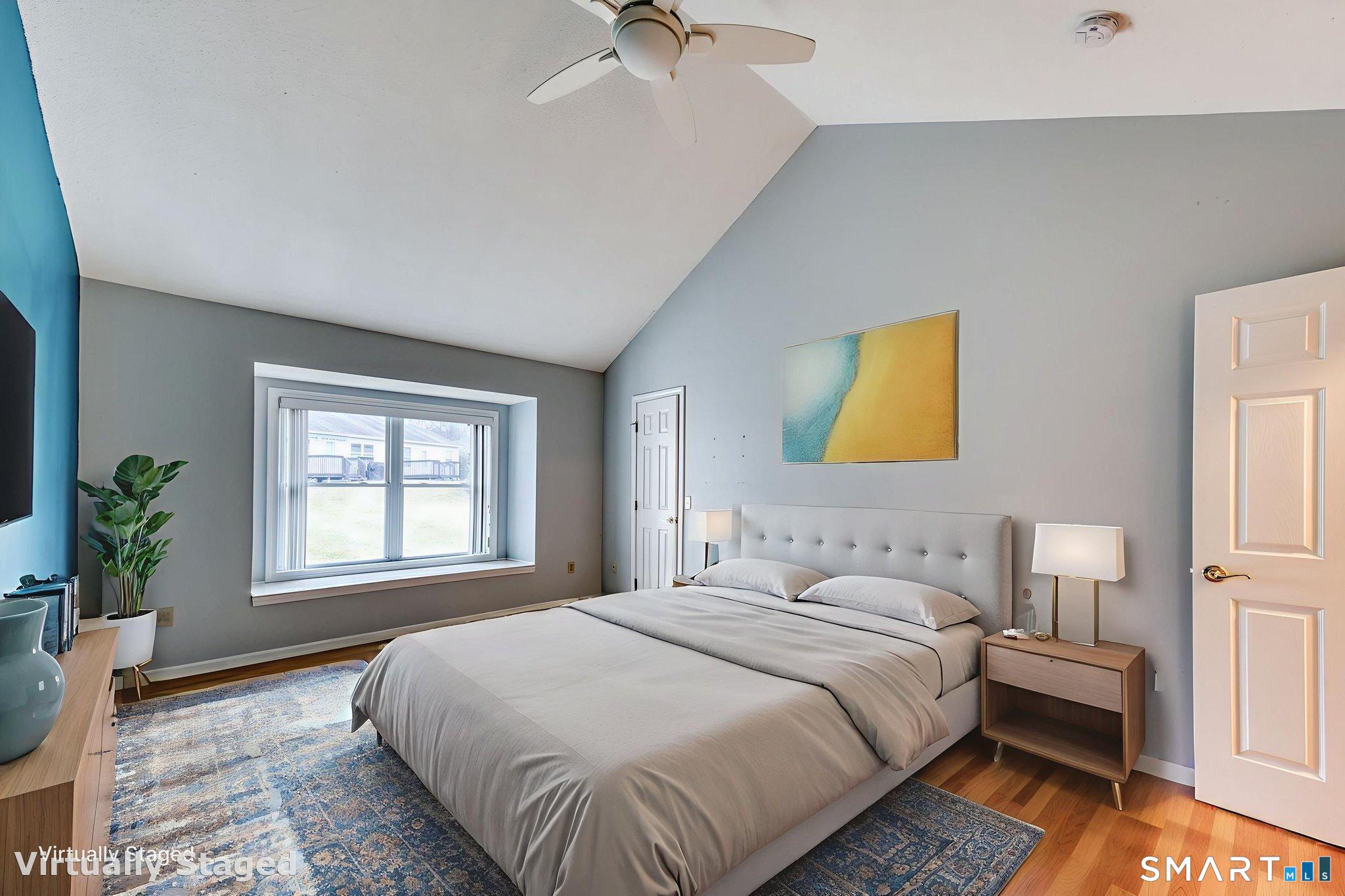 811 Village Road, Unit 811 Southington, CT 06489 - Photo 13 of 40 a bedroom with a bed lamps and table