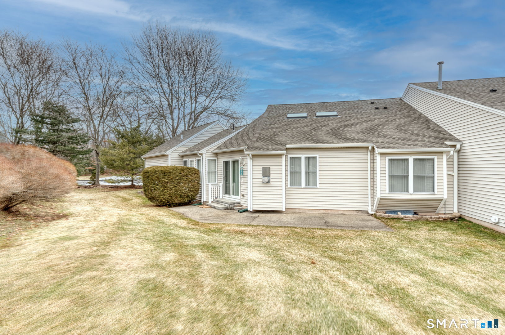 811 Village Road, Unit 811 Southington, CT 06489 - Photo 34 of 40 a view of a house with a patio