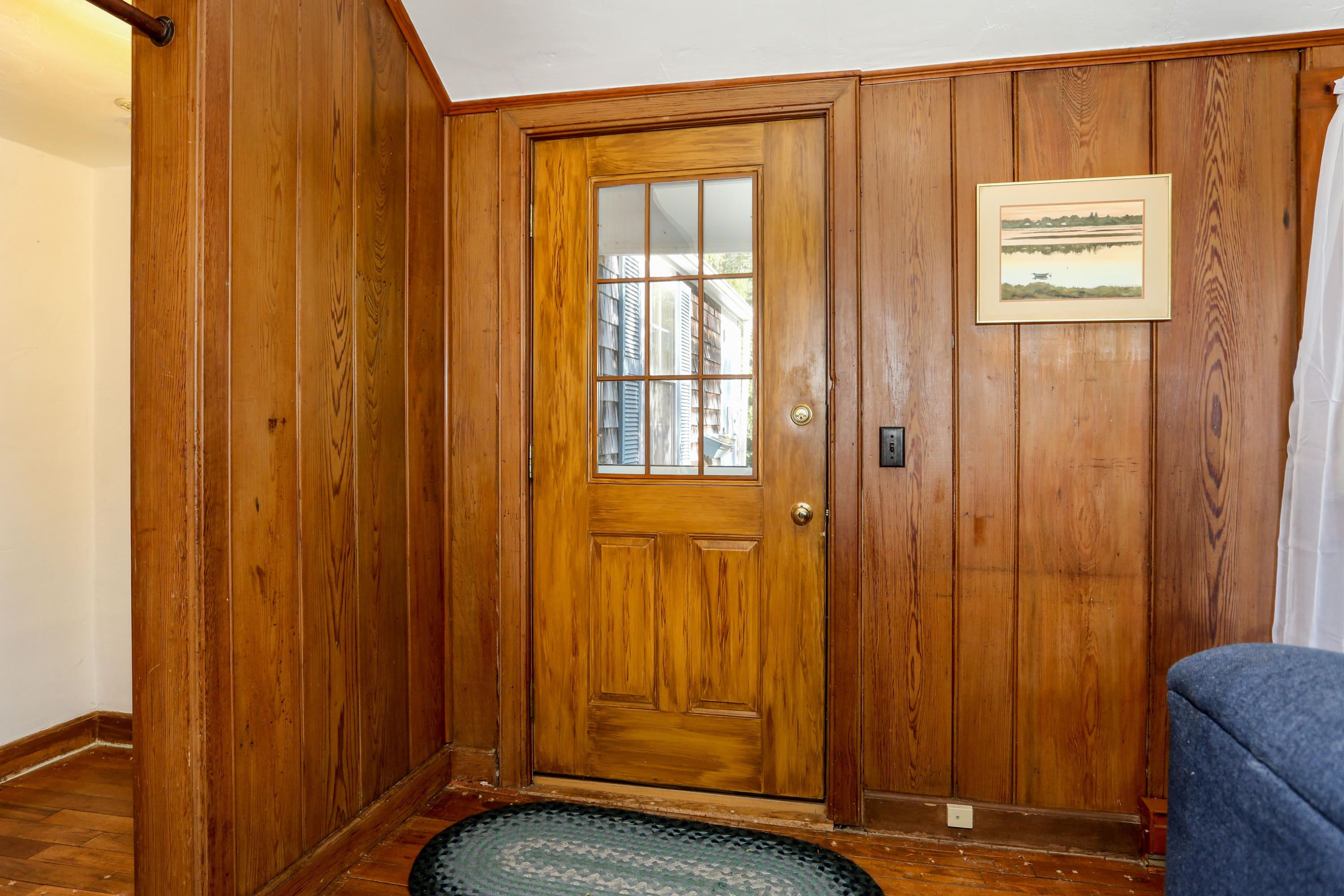 52 Gibson Road Orleans, MA 02653 - Photo 19 of 30 a view of a entryway with wooden walls