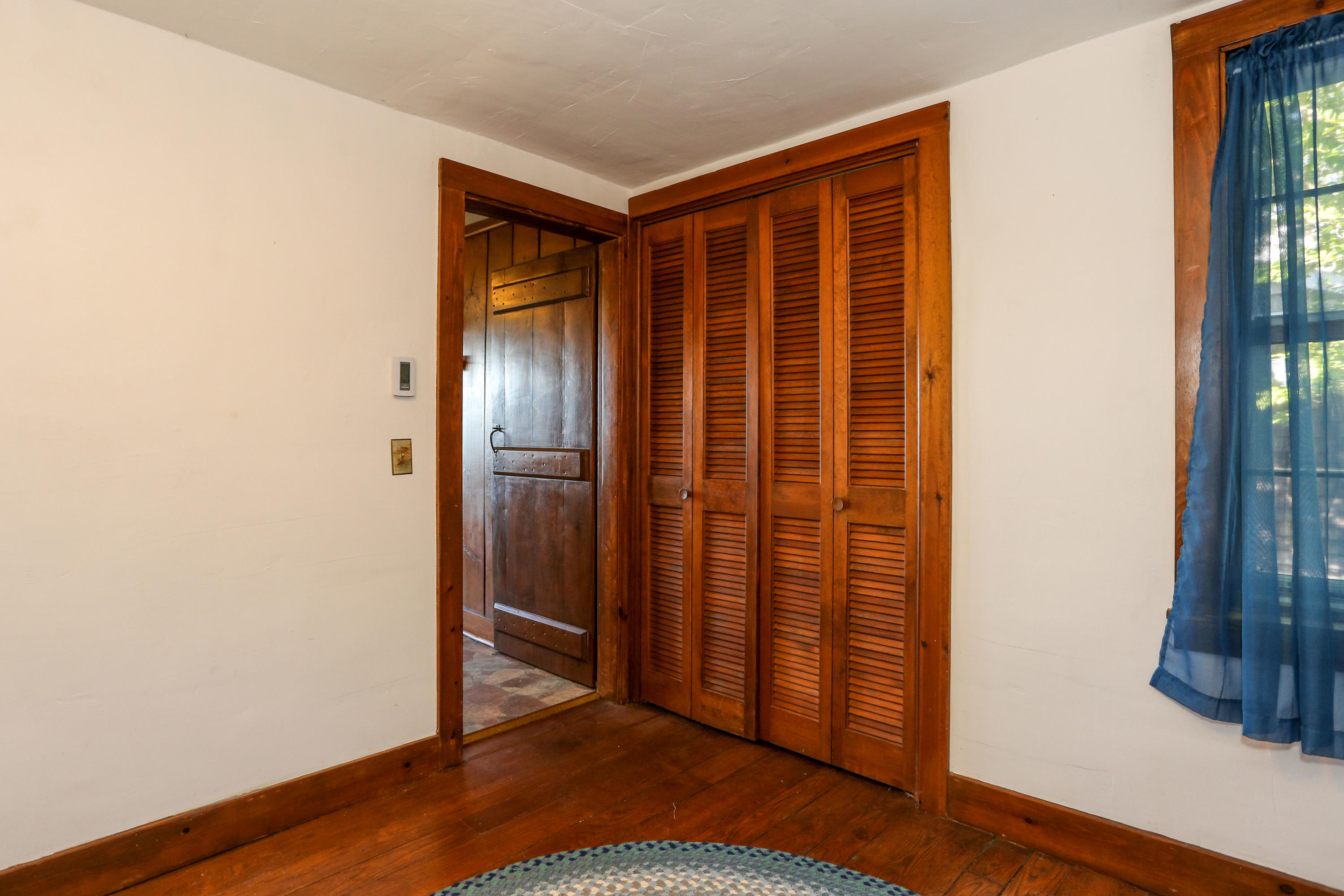 52 Gibson Road Orleans, MA 02653 - Photo 8 of 30 an empty room with wooden floor and a window