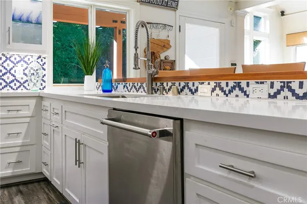 a view of a sink and a window