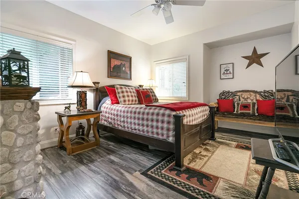 a bedroom with a bed and a table