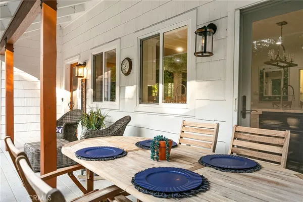 a front view of a house with outdoor seating