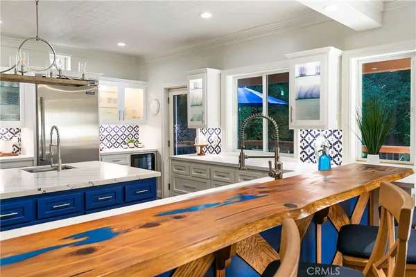 a kitchen with a table and chairs