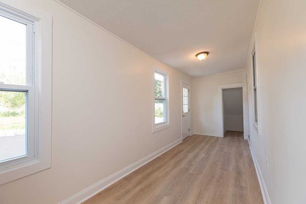 4 Farragut Road, Unit 1 Ipswich, MA 01938 - Photo 11 of 13 an empty room with windows and closet