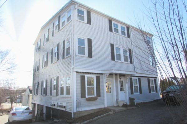 4 Farragut Road, Unit 1 Ipswich, MA 01938 - Photo 13 of 13 a front view of a building with a porch