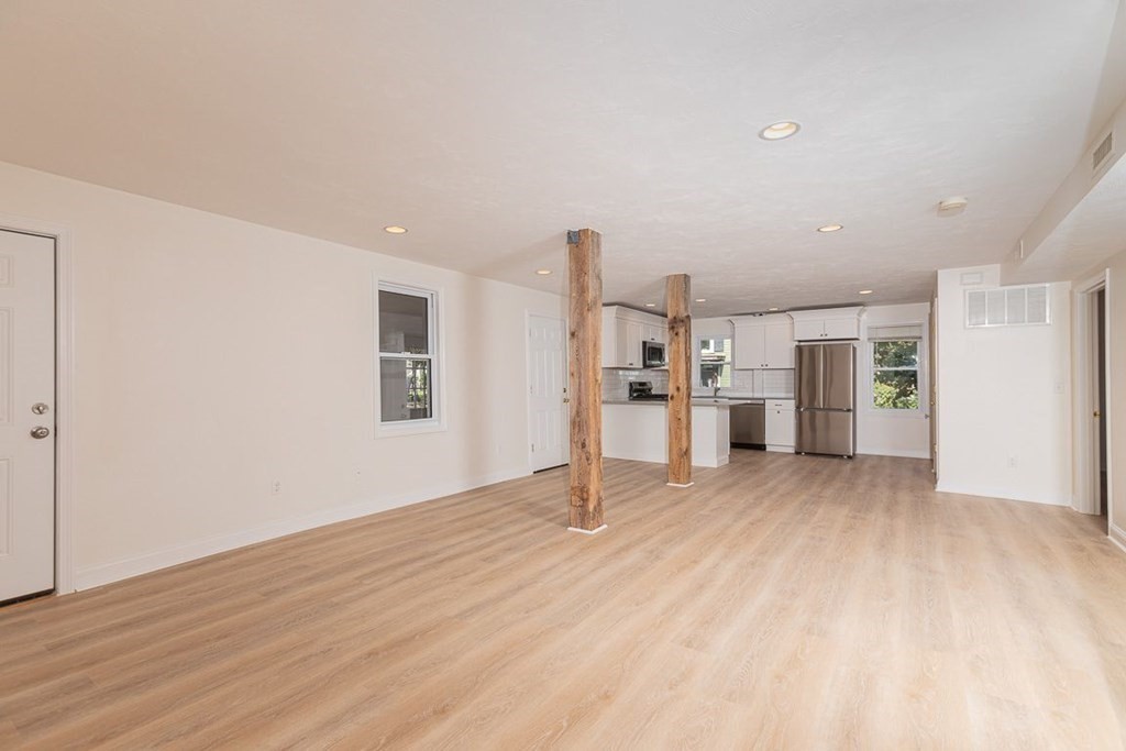 4 Farragut Road, Unit 1 Ipswich, MA 01938 - Photo 5 of 13 a view of empty room with wooden floor