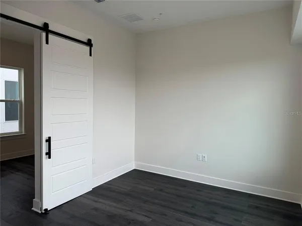 a bath room with a toilet and a bath tub