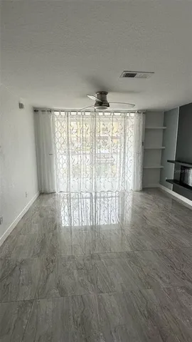 a view of an empty room with a window