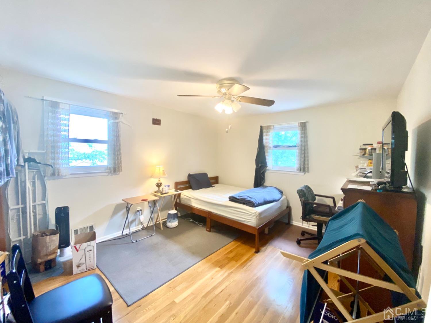 91 Holly Road Iselin, NJ 08830 - Photo 11 of 25 a living room with furniture and wooden floor