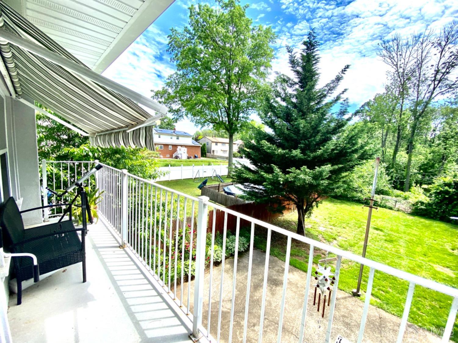 91 Holly Road Iselin, NJ 08830 - Photo 19 of 25 a view of balcony with wooden floor and seating space