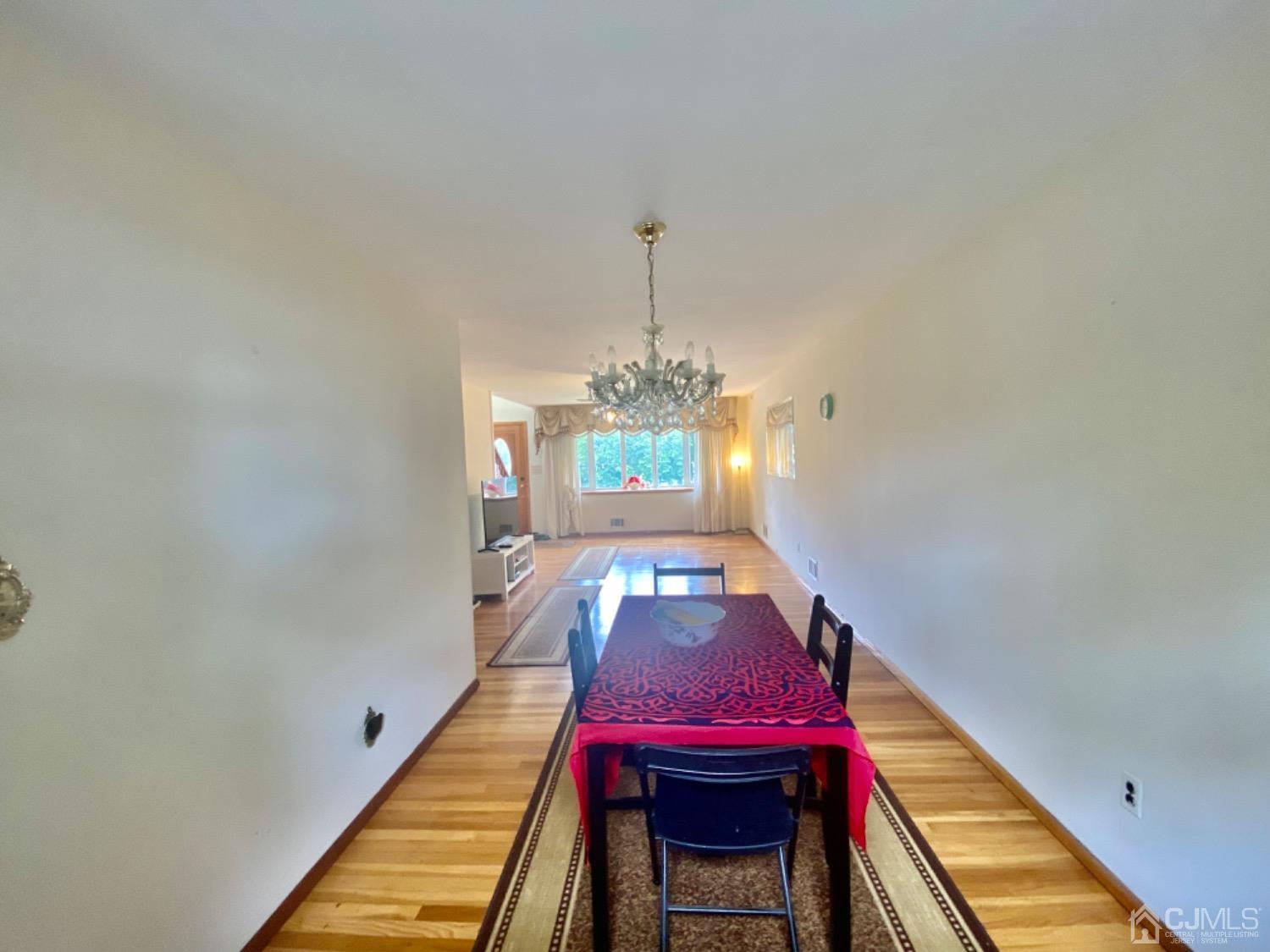 91 Holly Road Iselin, NJ 08830 - Photo 21 of 25 a view of a room with furniture and wooden floor