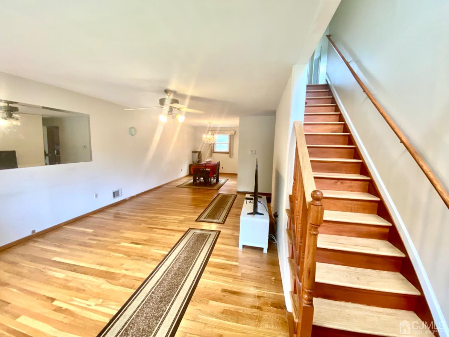 91 Holly Road Iselin, NJ 08830 - Photo 3 of 25 a view of swimming pool with wooden floor