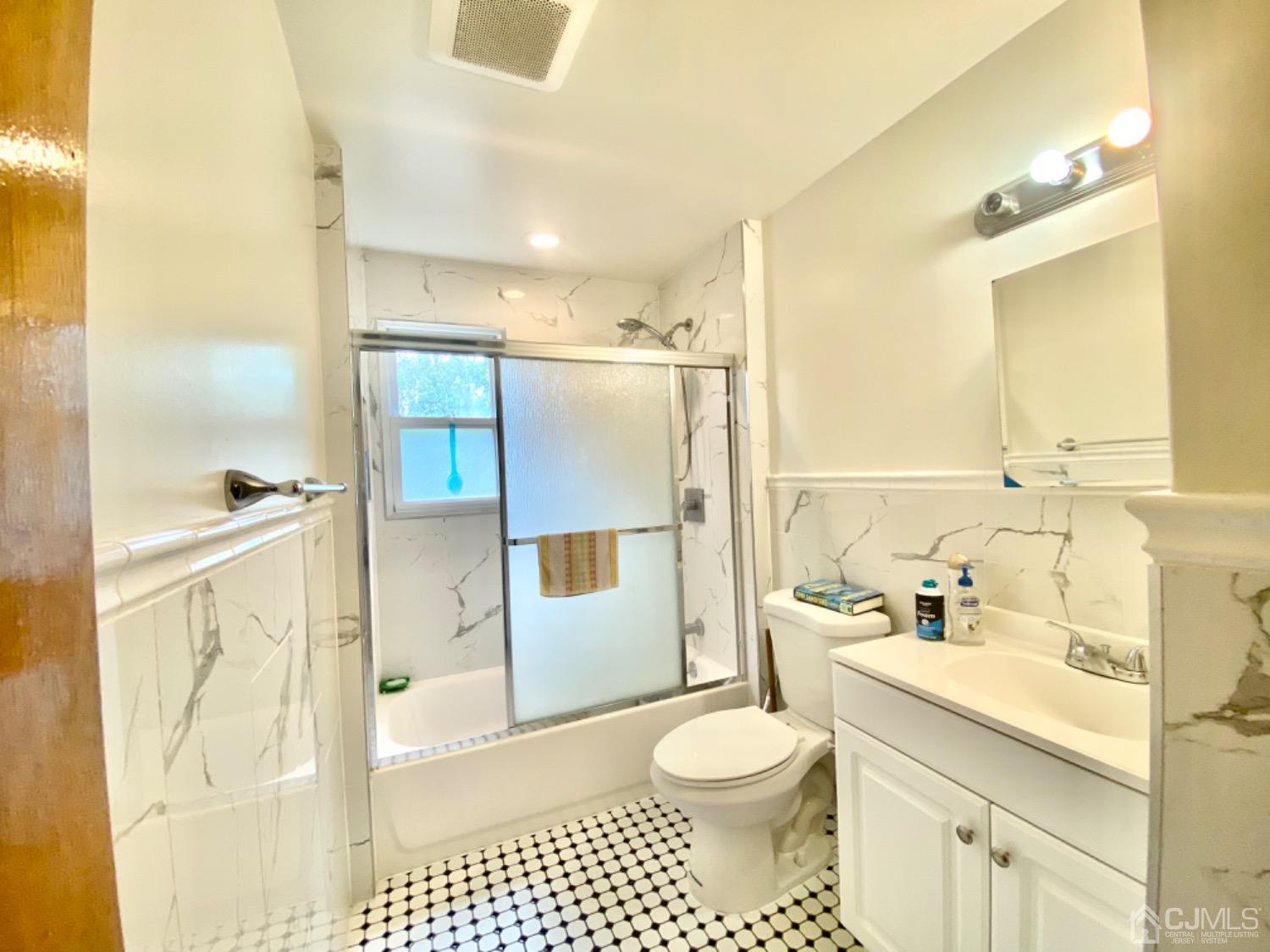 91 Holly Road Iselin, NJ 08830 - Photo 8 of 25 a bathroom with a sink toilet and shower