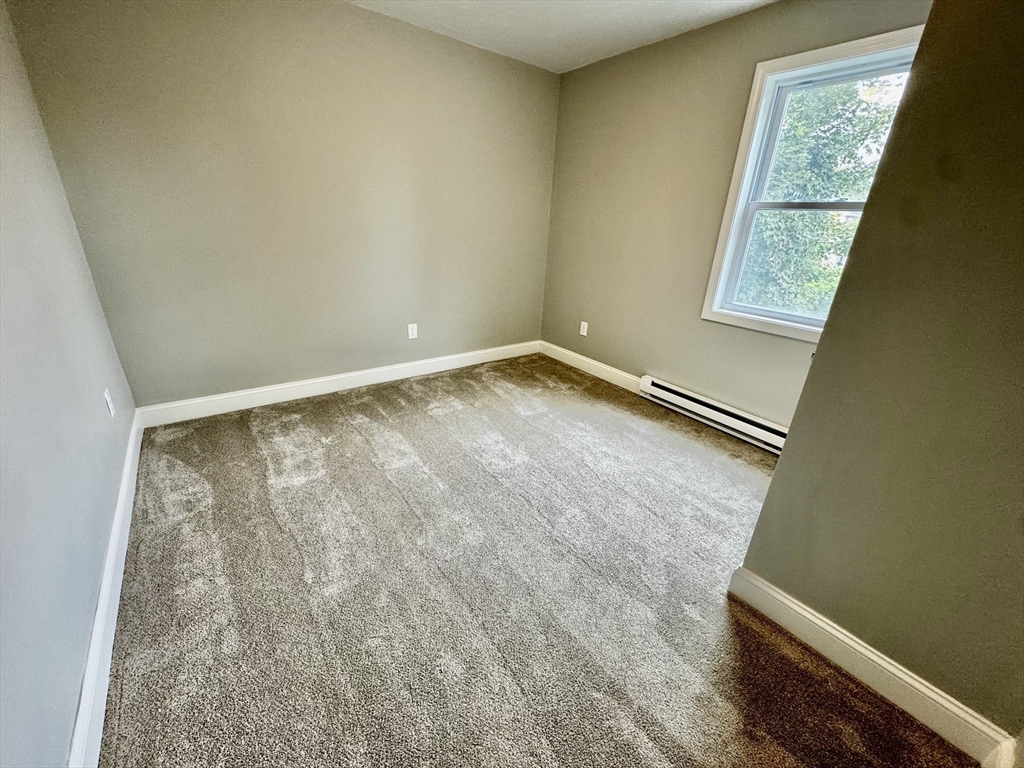 27 R Monroe Street Taunton, MA 02780 - Photo 12 of 25 a view of room with window and hallway
