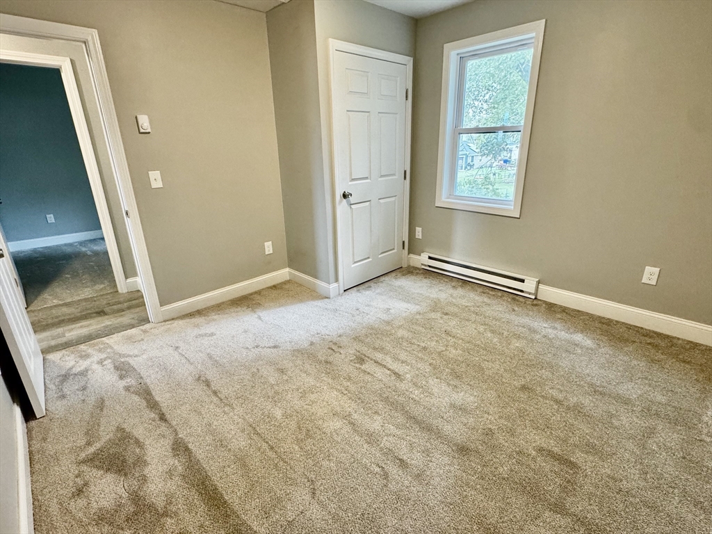 27 R Monroe Street Taunton, MA 02780 - Photo 18 of 25 a view of an empty room with a window