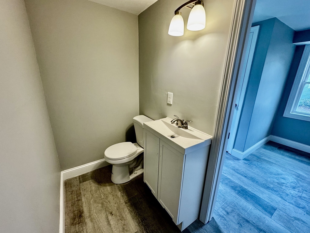 27 R Monroe Street Taunton, MA 02780 - Photo 10 of 25 a bathroom with a toilet sink and mirror