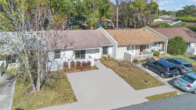 an aerial view of a house with a lake view