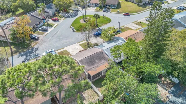 an aerial view of a house with a swimming pool yard and outdoor seating