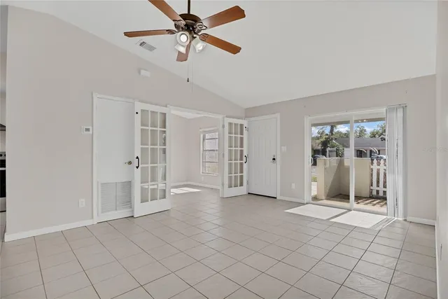 a view of a kitchen with an entryway and a chandelier