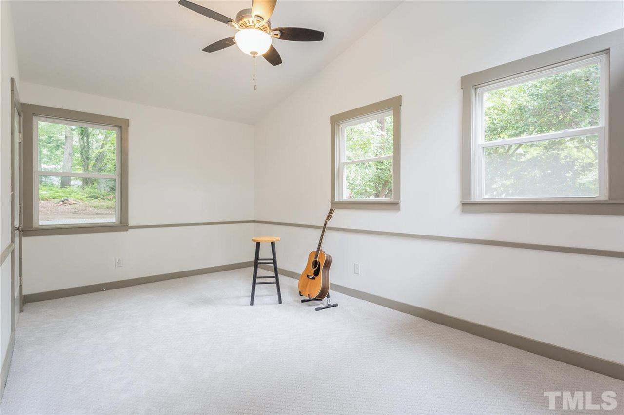 409 Stacy Street Raleigh, NC 27607 - Photo 22 of 25 a view of an empty room with a window