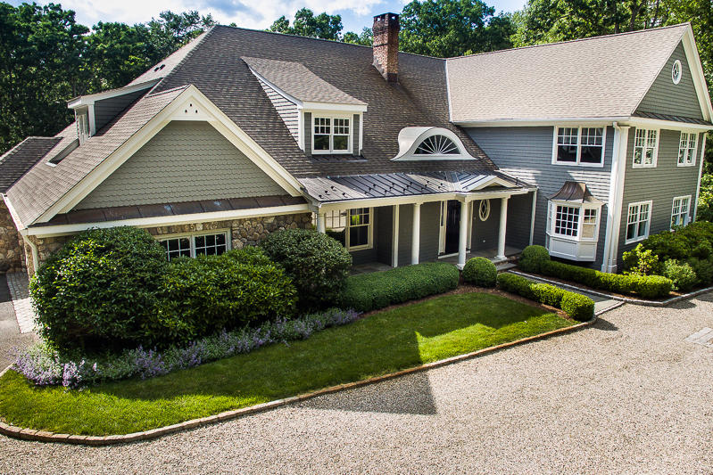 786 Cheese Spring Road New Canaan, CT 06840 - Photo 1 of 36 a front view of a house with a yard
