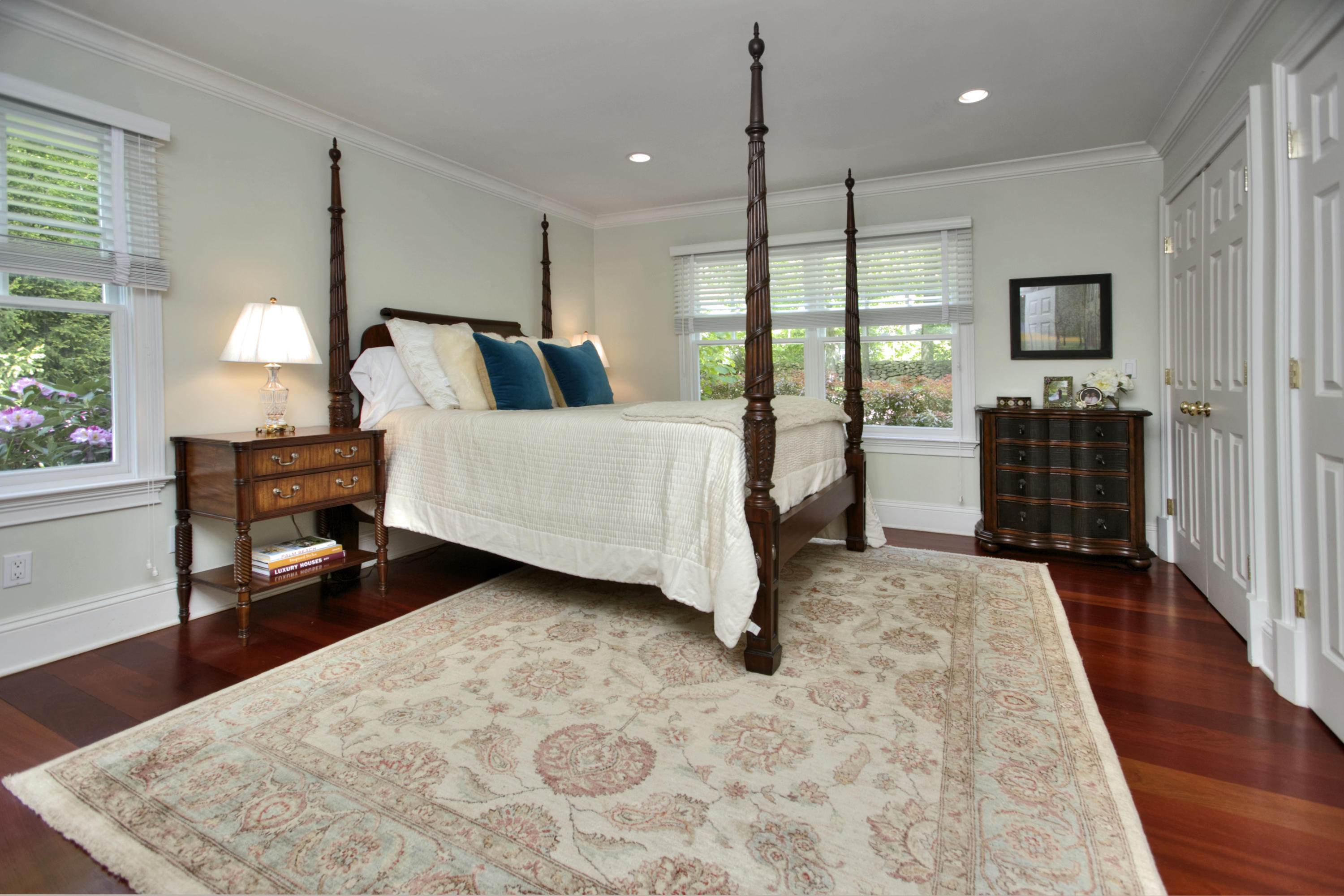786 Cheese Spring Road New Canaan, CT 06840 - Photo 21 of 36 a spacious bedroom with a bed a lamp and window