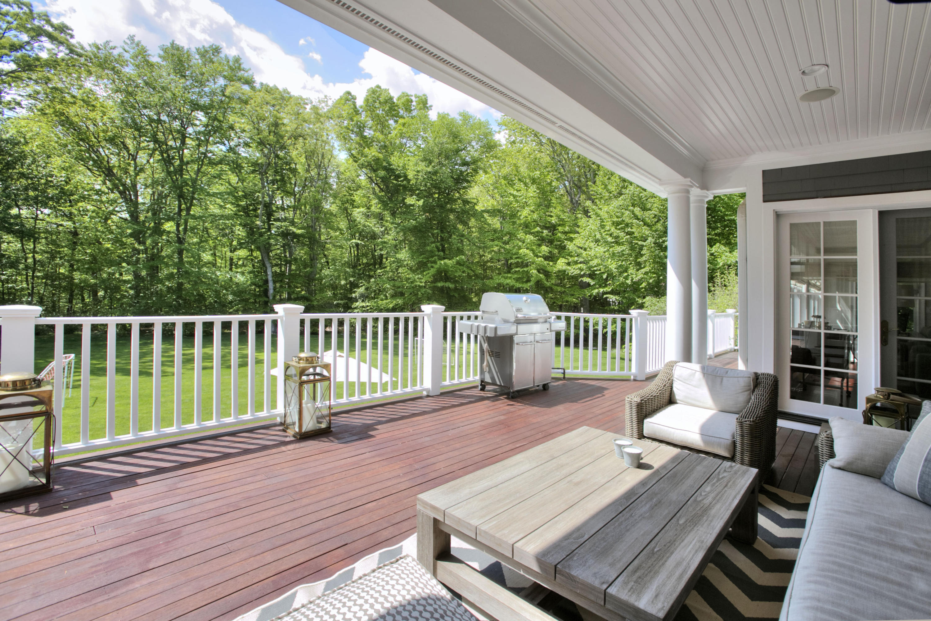 786 Cheese Spring Road New Canaan, CT 06840 - Photo 28 of 36 a view of a deck with two chairs and wooden floor
