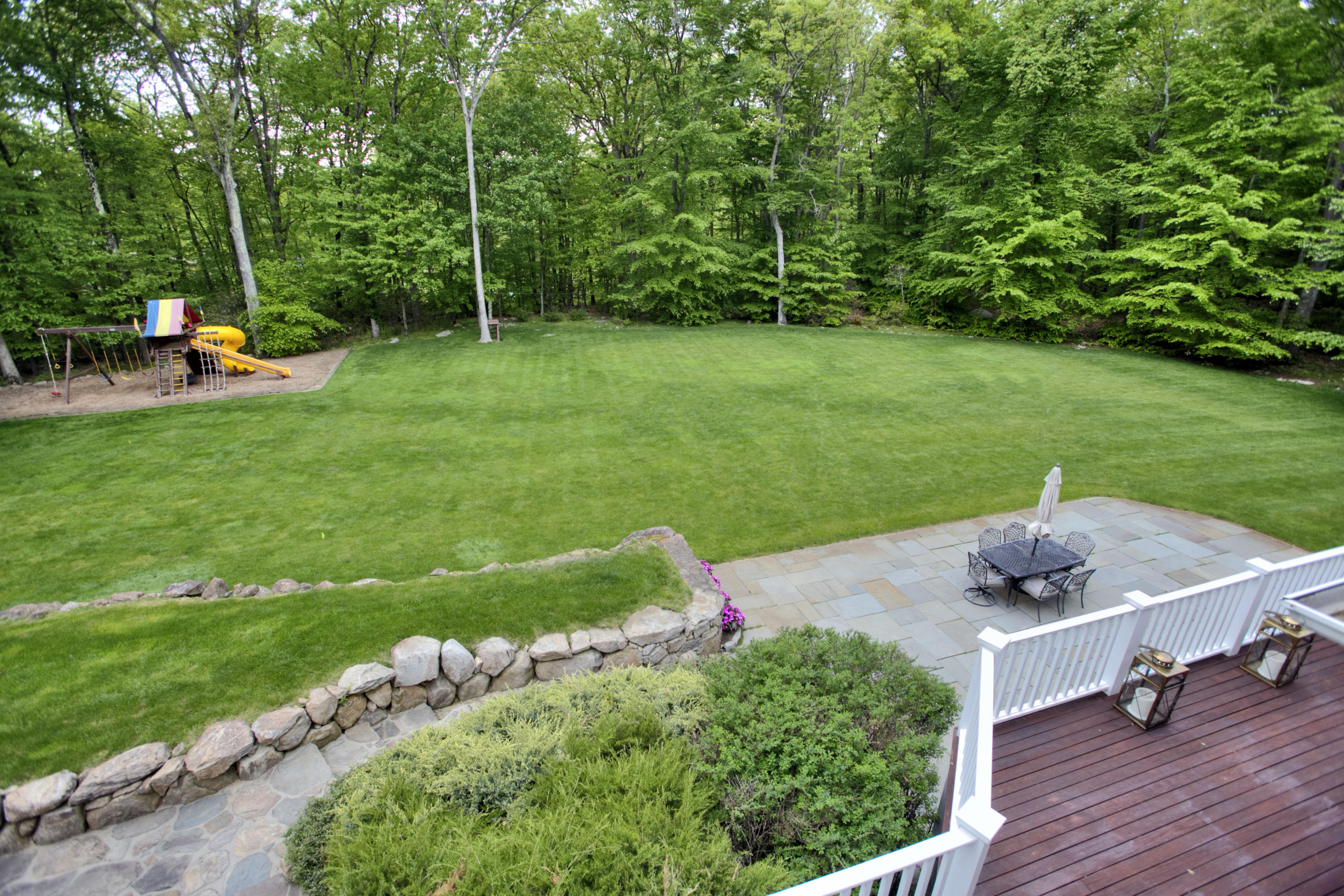786 Cheese Spring Road New Canaan, CT 06840 - Photo 29 of 36 a view of a garden with lawn chairs and swimming pool