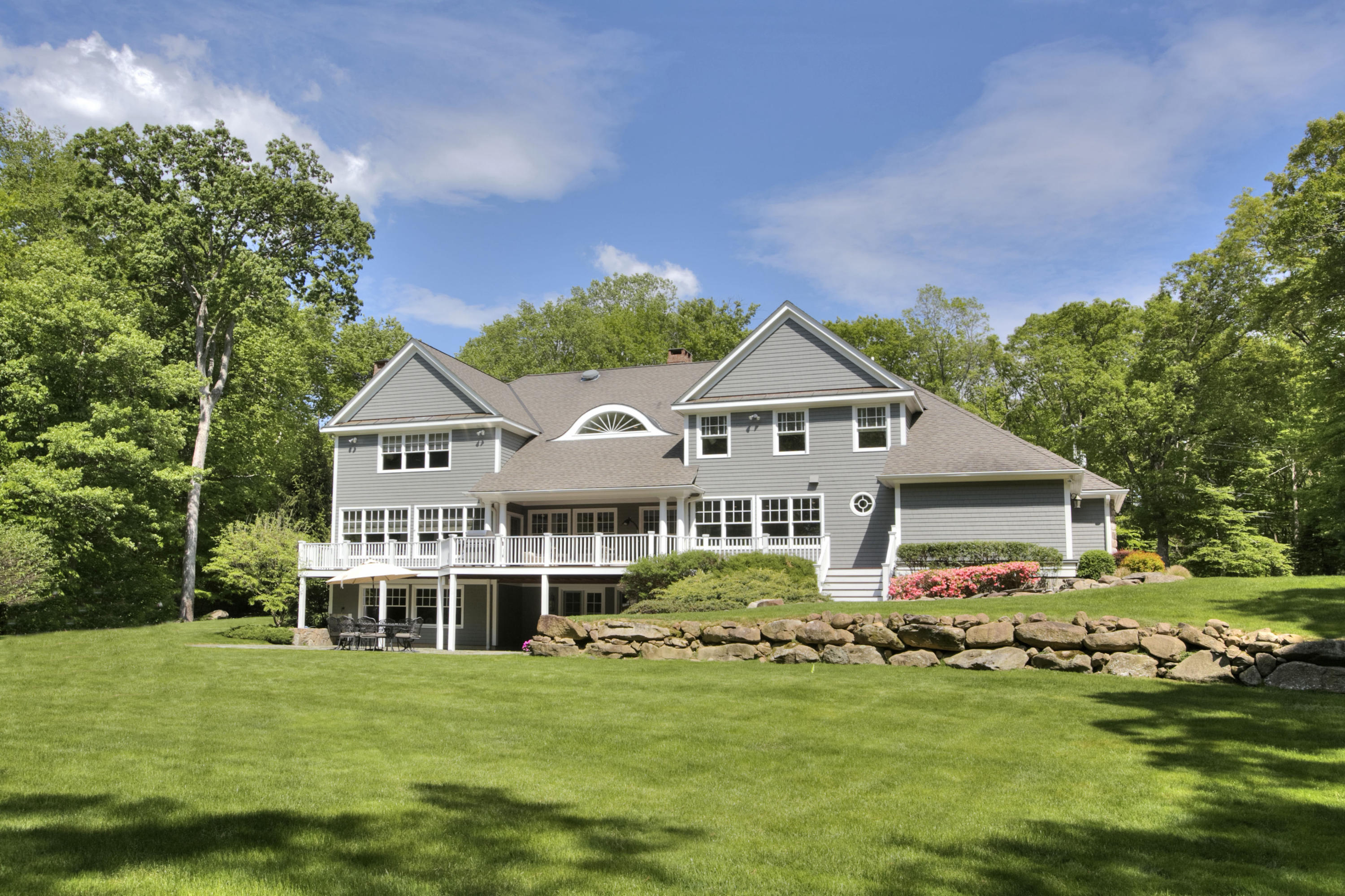 786 Cheese Spring Road New Canaan, CT 06840 - Photo 31 of 36 a front view of a house with a garden