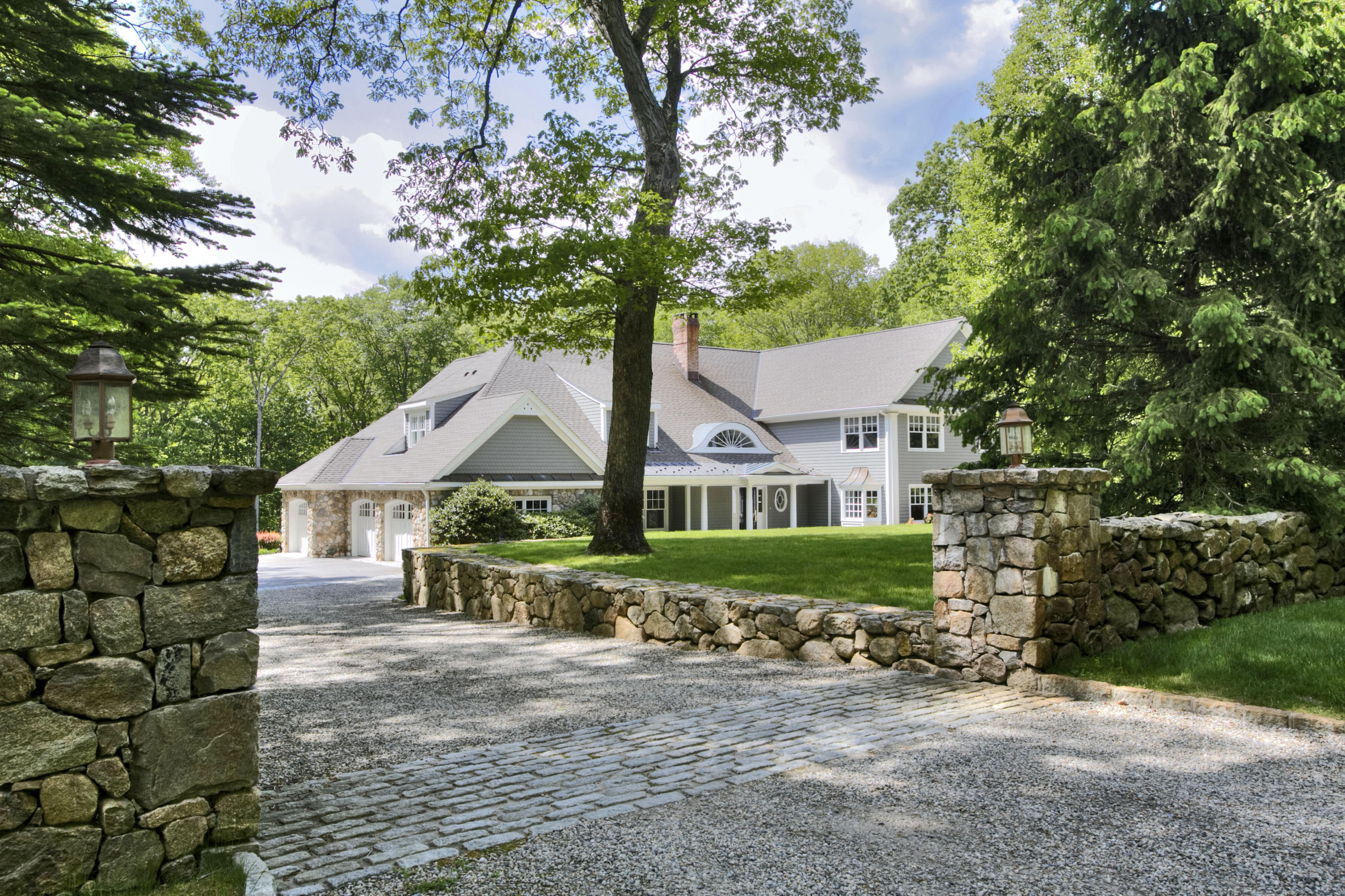 786 Cheese Spring Road New Canaan, CT 06840 - Photo 32 of 36 a front view of a house with a garden
